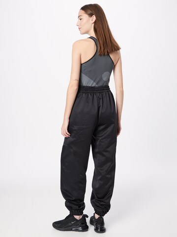 Effilé Pantalon de sport 'Tech-Style' Reebok en noir