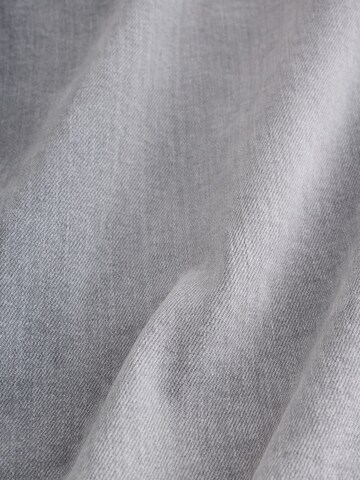 Next Slimfit Farkut värissä harmaa