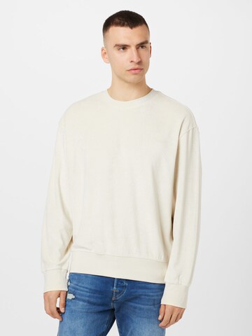 Sweat-shirt Calvin Klein Jeans en beige : devant