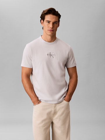 Calvin Klein Jeans Тениска в бежово: отпред