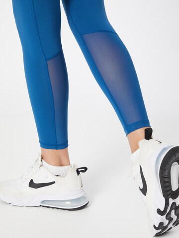 NIKE Skinny Sports trousers in Blue