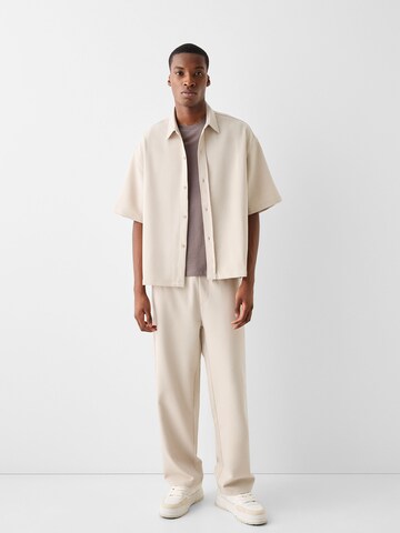 Bershka Loose fit Trousers in Beige