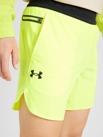 UNDER ARMOUR - Regular Calças de desporto 'Peak' em amarelo