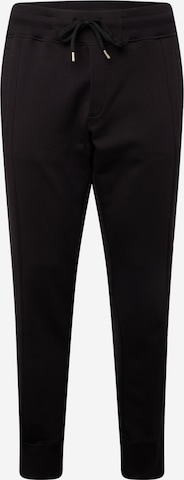 Pantaloni de la Versace Jeans Couture pe negru: față