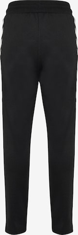Effilé Pantalon de sport 'Kick' Hummel en noir