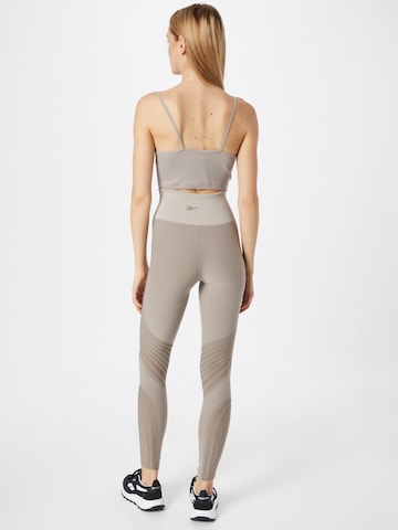 Skinny Pantaloni sportivi 'Les Mills' di Reebok in grigio