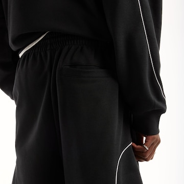 Loosefit Pantalon 'Trackside French Terry Short 7"' new balance en noir