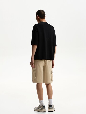 Bershka Loose fit Cargo trousers in Yellow