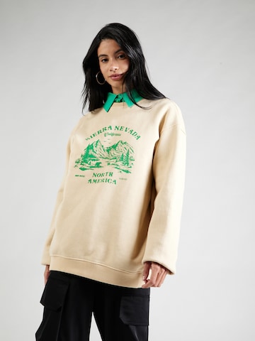 Sweat-shirt 'Sierra Nevadat' Nasty Gal en beige : devant