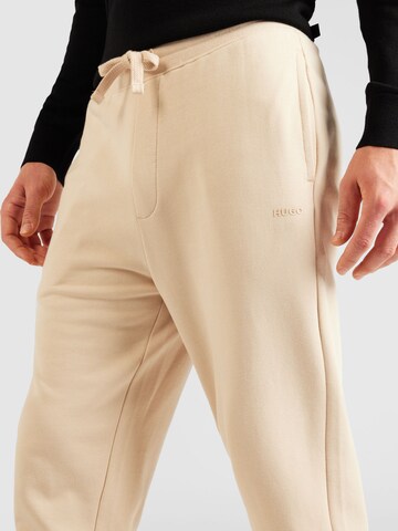Tapered Pantaloni 'Dayote' di HUGO in beige