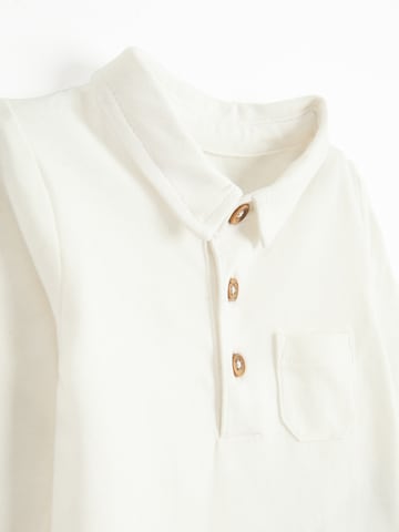 Salopetă de la Cool Club pe alb