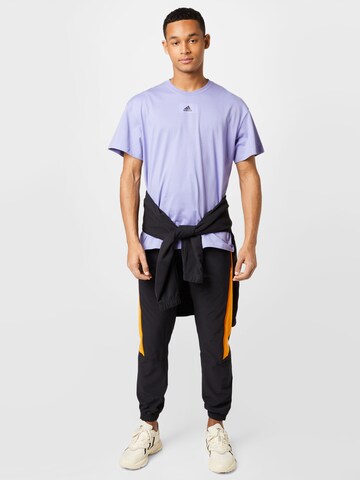 ADIDAS SPORTSWEAR Tapered Παντελόνι φόρμας 'Travel Vent' σε μαύρο