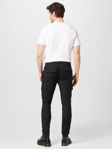 Skinny Pantalon cargo Calvin Klein Jeans en noir