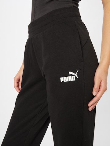 PUMA Tapered Sportbroek 'Essentials' in Zwart