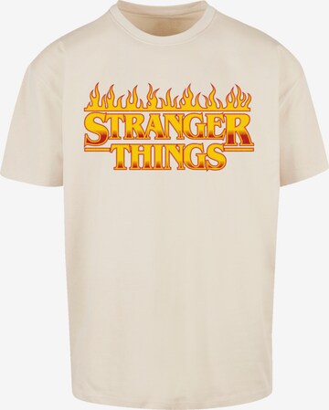 F4NT4STIC T-Shirt 'Stranger Things Fire Logo Netflix TV Series' in Beige: predná strana