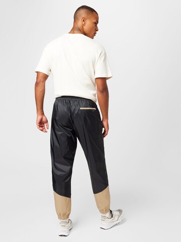 Nike Sportswear Zwężany krój Spodnie w kolorze czarny