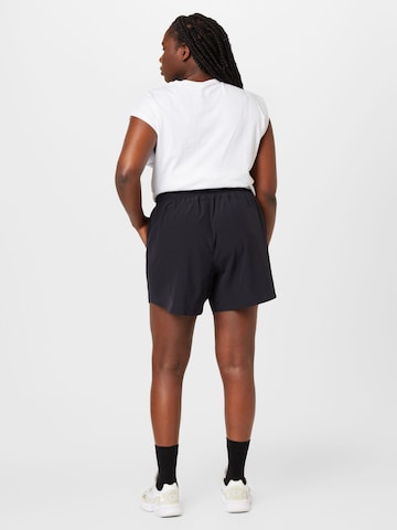 UNDER ARMOUR Loosefit Sportovní kalhoty – černá