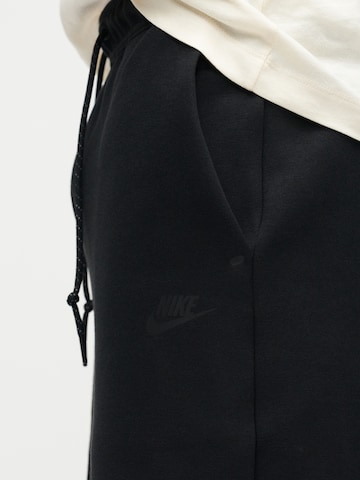 Loosefit Pantalon 'TECH FLC' Nike Sportswear en noir