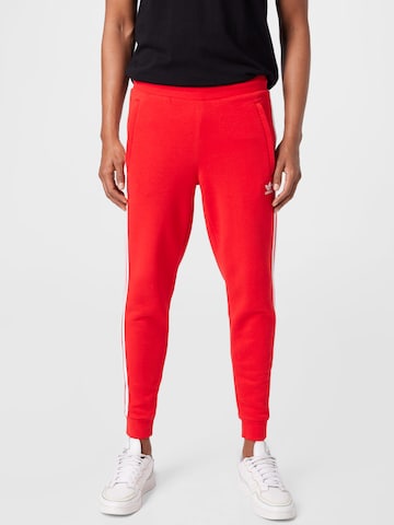 ADIDAS ORIGINALS - Pantalón en rojo: frente