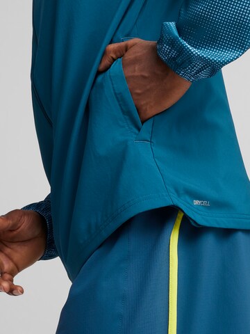 Veste de sport 'RUN FAVORITE AOP' PUMA en bleu