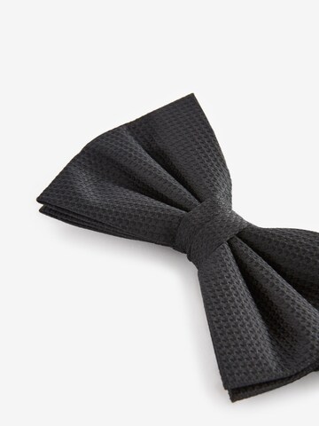 Next Fliege in Schwarz