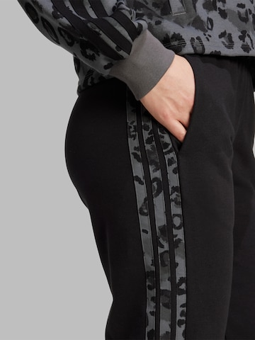 Tapered Pantaloni sport de la ADIDAS SPORTSWEAR pe negru