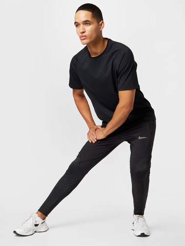 NIKE Regular Workout Pants 'Strike' in Black