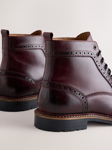 Boots stringati di Next in rosso