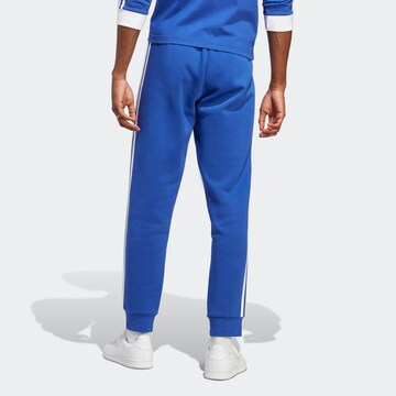 ADIDAS ORIGINALS Slimfit Broek 'Adicolor Classics' in Blauw