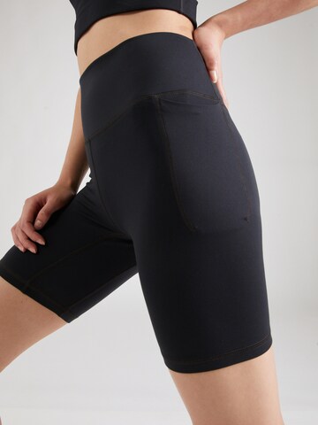 UNDER ARMOUR Skinny Sportbroek 'Meridian' in Zwart