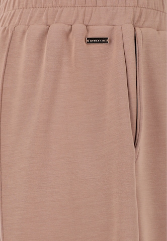 Athlecia - Pierna ancha Pantalón deportivo 'Jacey' en beige