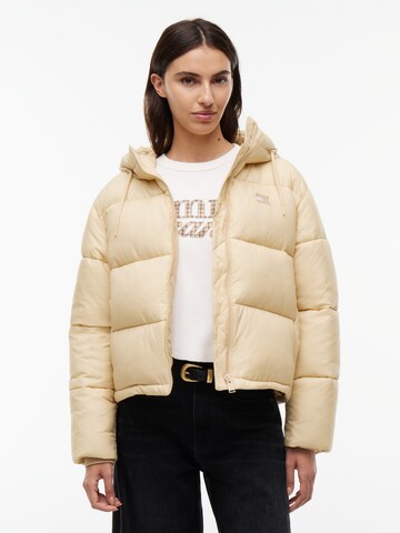 Tommy Jeans Zimní bunda – béžová: přední strana