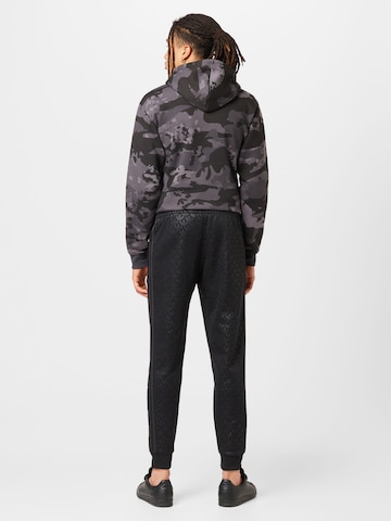 ADIDAS ORIGINALS Tapered Pants 'Graphics Monogram Sst' in Black