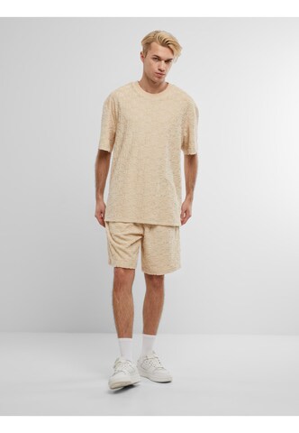 Maglietta di Karl Kani in beige