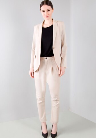 IMPERIAL Tapered Pleat-Front Pants in Beige