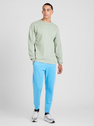 Nike Sportswear Tapered Broek 'CLUB' in Blauw