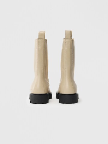 TOMMY HILFIGER - Botas Chelsea en beige: atrás