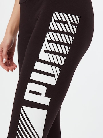 Skinny Pantaloni sportivi di PUMA in nero