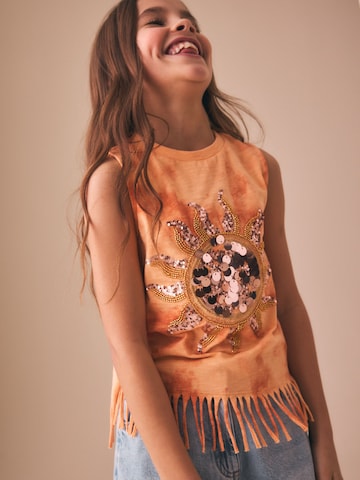 Haut Next en orange : devant