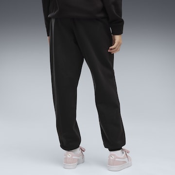 PUMA Tapered Sportbroek 'Essentials Nature 2.0' in Zwart