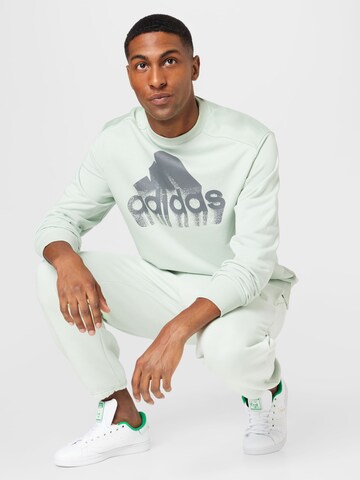 ADIDAS SPORTSWEAR Avsmalnet Sportsbukser 'Essentials Feelvivid  Fleece Straight' i grønn