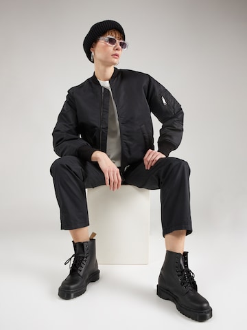 Carhartt WIP Prehodna jakna 'Olten' | črna barva