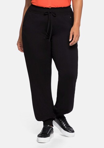 SHEEGO Tapered Pants in Black: front