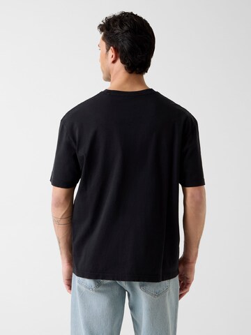 GUESS T-Shirt in Schwarz