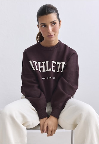 Pull-over de sport Aim'n en marron : devant