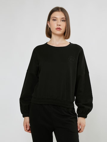 melns Influencer Sportisks džemperis: no priekšpuses