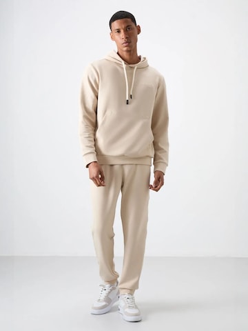 Survêtement Tommy Life en beige : devant
