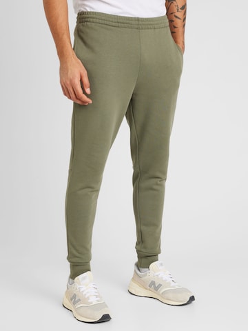 Slimfit Pantaloni de la LACOSTE pe verde: față