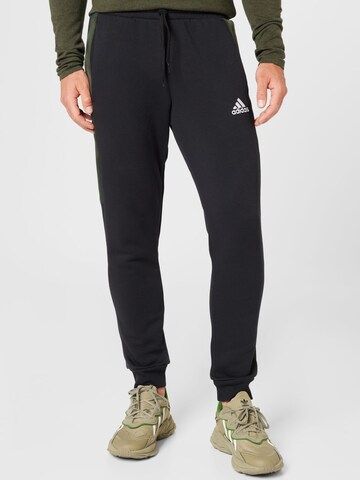 ADIDAS SPORTSWEAR Tapered Workout Pants 'Essentials Camo' in Black: front