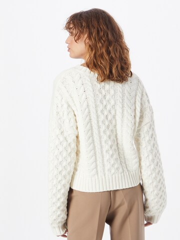 Oval Square Tröja 'Power' i beige